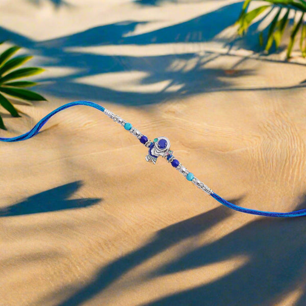 exquisite blue stone silver rakhi