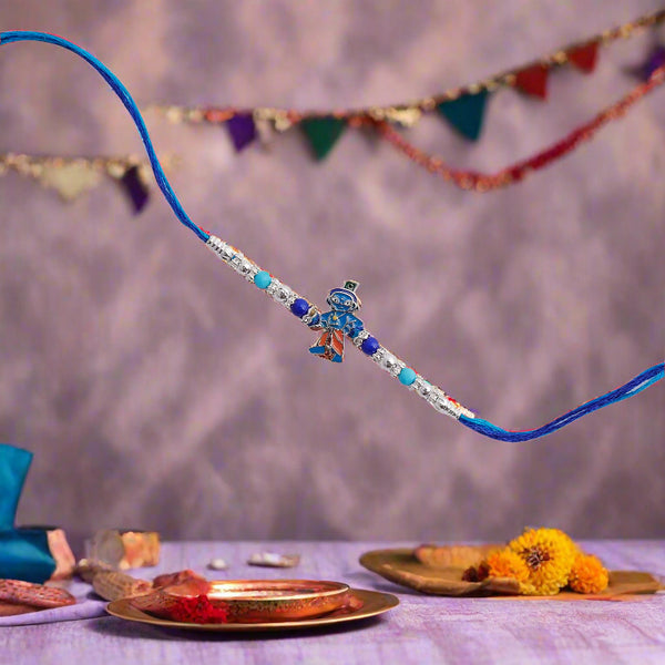 exquisitely crafted small Krishna rakhi.