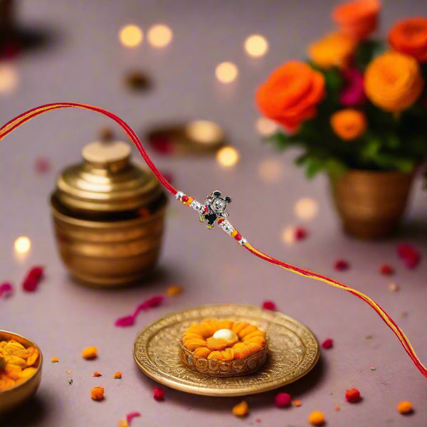 Red thread with a small decorative item