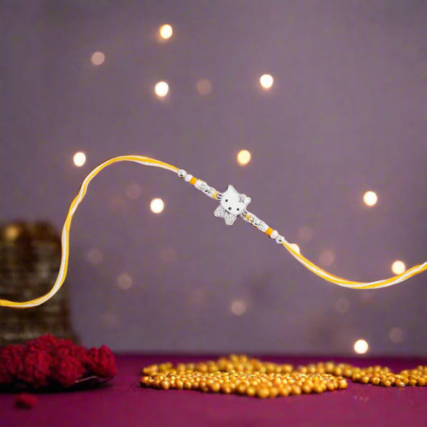 yellow rakhi featuring an adorable cute cat design.