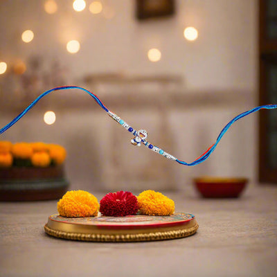 blue rakhi featuring a charming Doraemon theme.