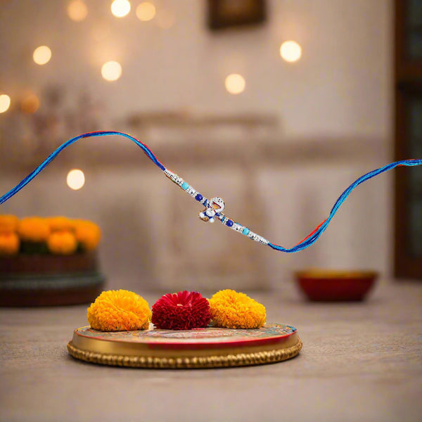blue rakhi featuring a charming Doraemon theme.