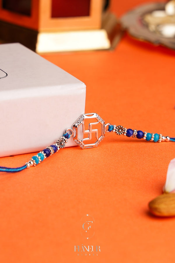 Rakhi with this exquisite silver piece