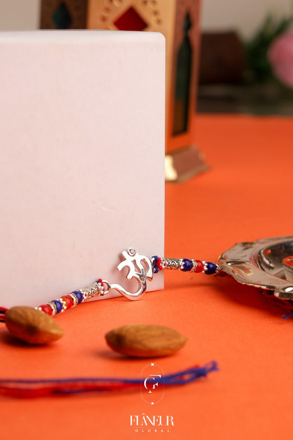 Raksha Bandhan with this exquisite Om Spacil Rakhi adorned